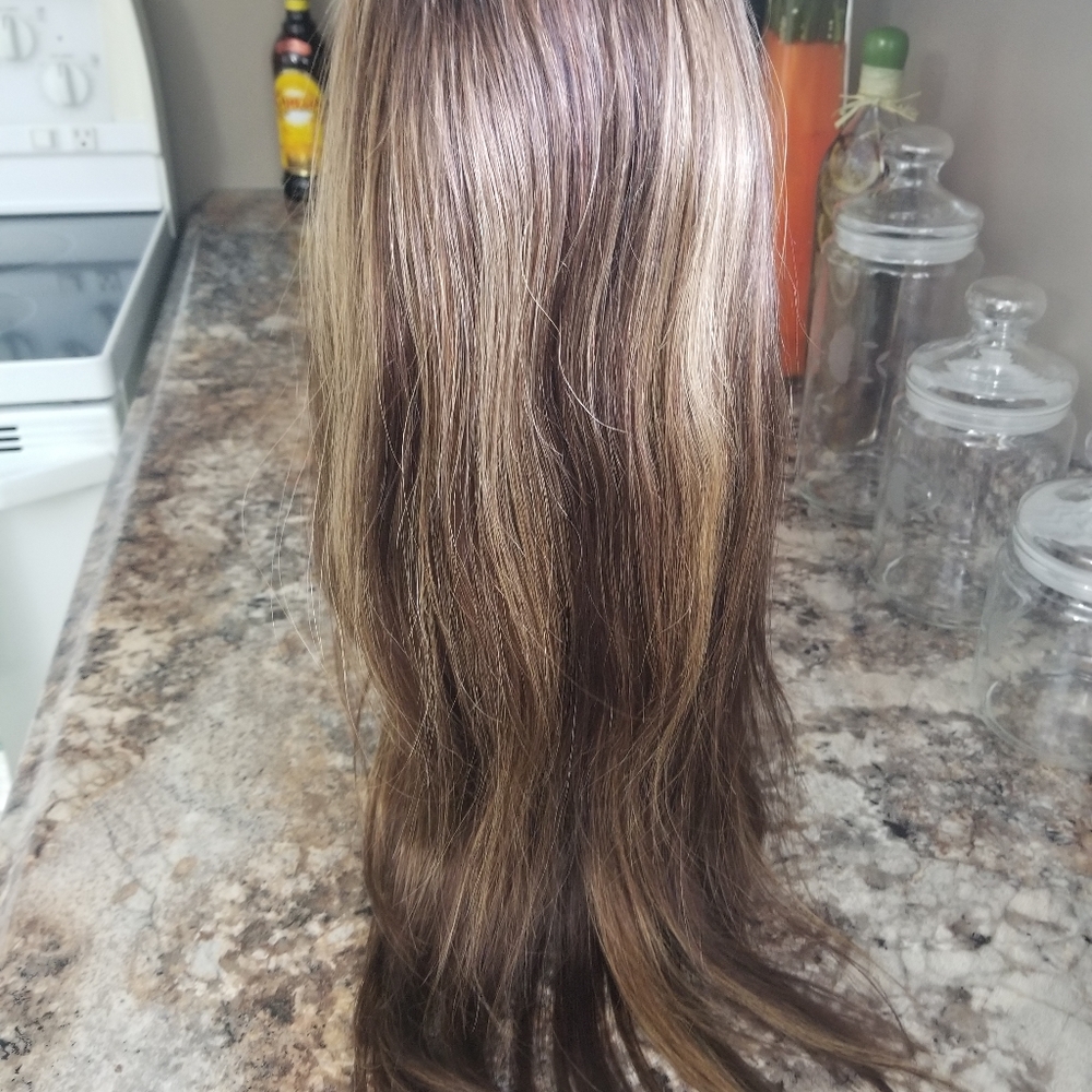 Brand new layer wig with some blonde highlights.